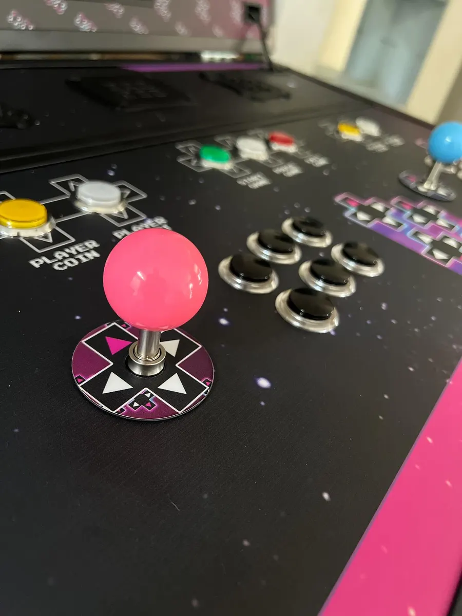 Close-up of a Phantom control panel with real arcade sticks and buttons